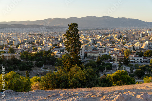 Panoramic cityscape view of Athens with Temple of Hephaestus at sunset