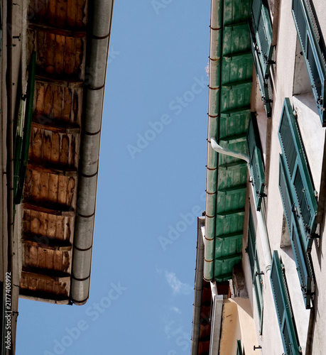 View from below of wooden roofs with rain gutters