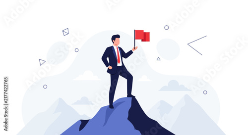 Businessman standing on mountain peak holding red flag, symbolizing success, achievement, and vision