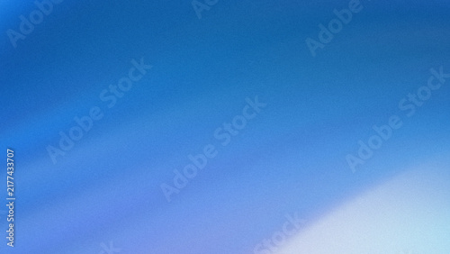 Clear blue sky gradient background with soft light flare