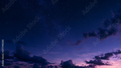A mesmerizing night sky filled with stars and colorful clouds, creating a tranquil and dreamy atmosphere.