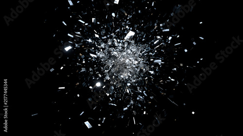 An explosion of silver shards creating a dynamic visual effect against a black backdrop.