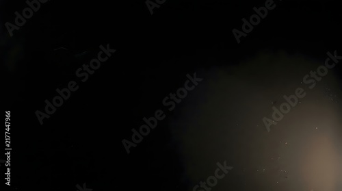 Abstract dark background featuring an elegant obsidian film veil texture with soft light gradients for professional creative design projects