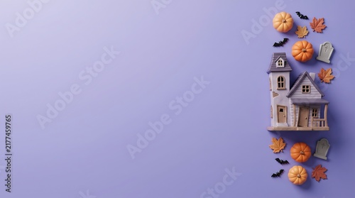 3D rendered halloween haunted house with pumpkins and bats