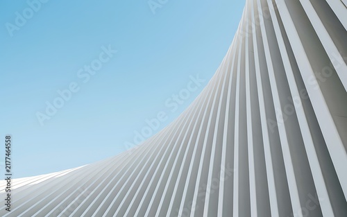 Abstract Low Angle View of White Curved Architectural Rib Fins Against Clear Blue Sky