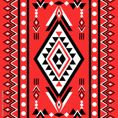 Seamless red black and white tribal geometric pattern with diamond motifs and ethnic ornamental borders.