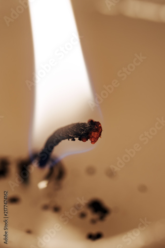 Canvastavla Macro close-up of a burning candle wick and flame