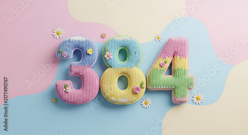 Whimsical 384 numbers crafted from soft knitted yarn in pastel colors with delicate flower accents on a wavy backdrop
