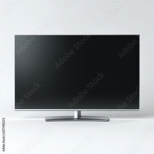 A sleek, modern flat screen television displays a blank black screen, standing on its minimalist base against a clean white background