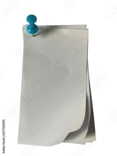 Foto A stack of light grey paper sheets held together by a single small blue push pin
