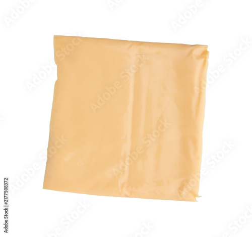 square slice of yellow processed toaster cheese wrapped in transparent plastic film isolated on white background, sandwich cheddar cheese mockup