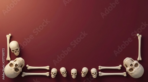 Naklejka Human skeleton bones arranged on red background