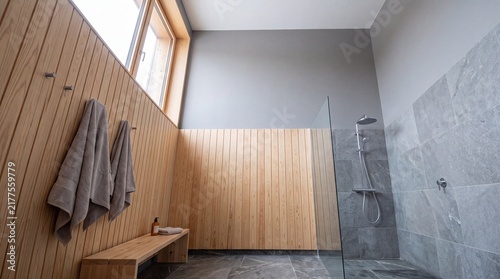 Modern Minimalist Bathroom with Wood Paneling and Stone Shower