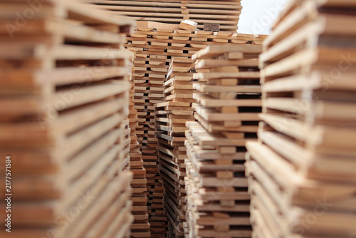 Konstfotografi Sharp central stack of lumber surrounded by blurred piles