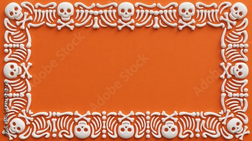 Halloween 3D decorative background with copy space against a vibrant orange backdrop featuring a bone and skull border
