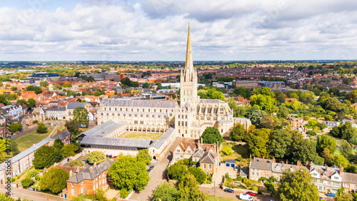 Aerial view of the historical Cathedral in Norwich, Norfolk, UK basked in sunlight