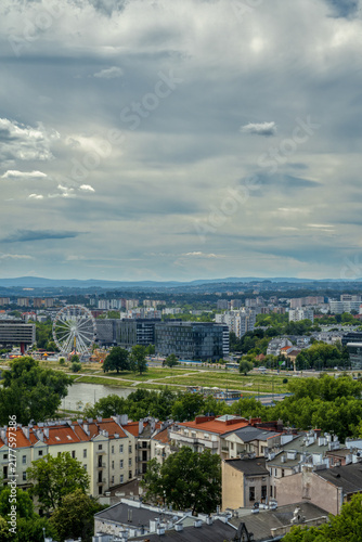 Krakow cityscape with Ferris wheel and Vistula river panorama