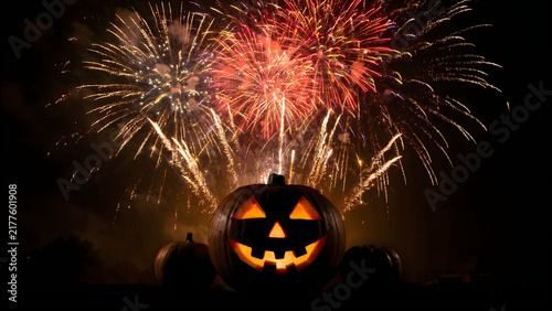 Glowing Jack-o-lantern pumpkin with colorful fireworks display in the night sky