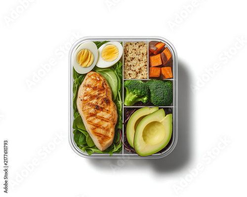 Top View of Healthy Meal Prep Box with Grilled Chicken Avocado Quinoa and Boiled Egg