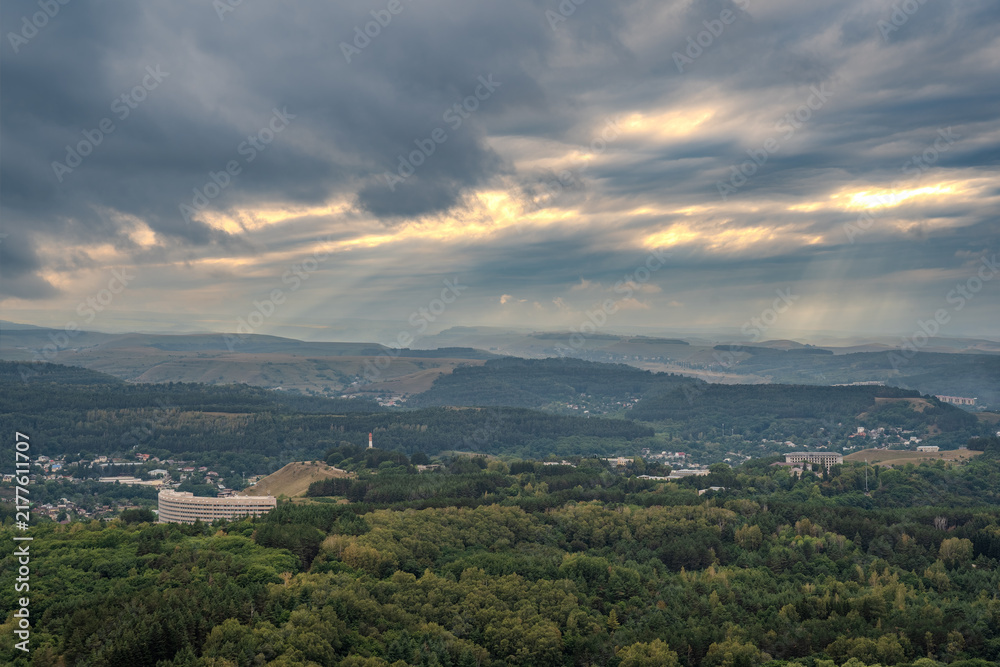 Fototapeta premium Layers of green mountains and hills in the haze during sunset. Panoramic View of Green hills and Meadow.