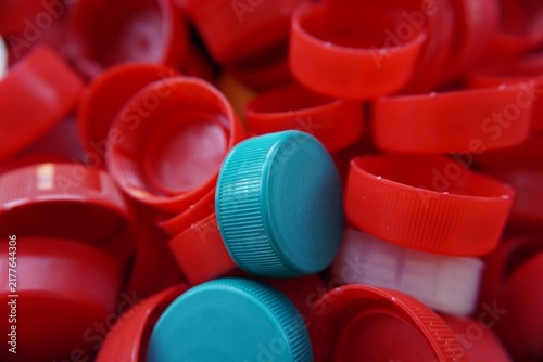 Принти на полотні A close-up of plastic bottle caps in bright colors, the concept of recycling and environmental protection