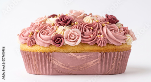 Elegant dusty pink rose swirl cupcake with gold pearl decorations