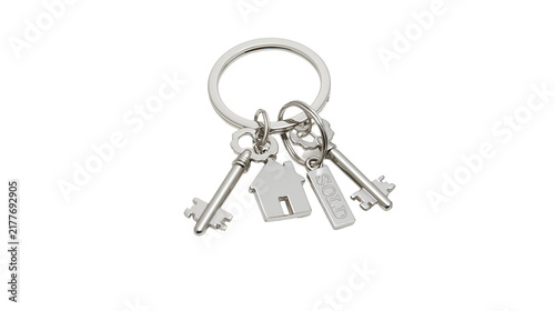 Konstfotografi Isolated silver house and key charms with SOLD tag on a shiny metal keychain