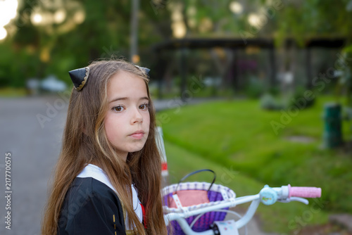 Quadro su tela Young girl with long brown hair, wearing cat ears