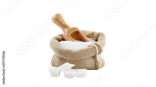 Foto Isolated burlap sack filled with white granular sugar, with a wooden scoop and sugar cubes