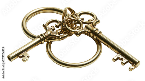 Canvas Print Isolated old fashioned skeleton keys on a keyring, shiny golden antique brass ob