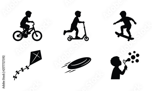 Silhouettes of children playing outdoors with bikes scooters and toys.