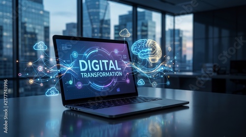 A sleek laptop displays 'DIGITAL TRANSFORMATION' with futuristic graphics in a modern office setting.