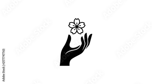 Hand holding delicate flower symbol