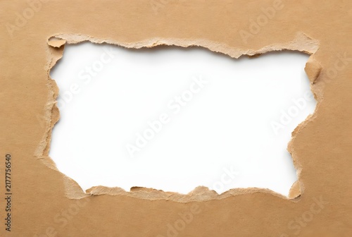 Torn brown paper frame with white center hole background