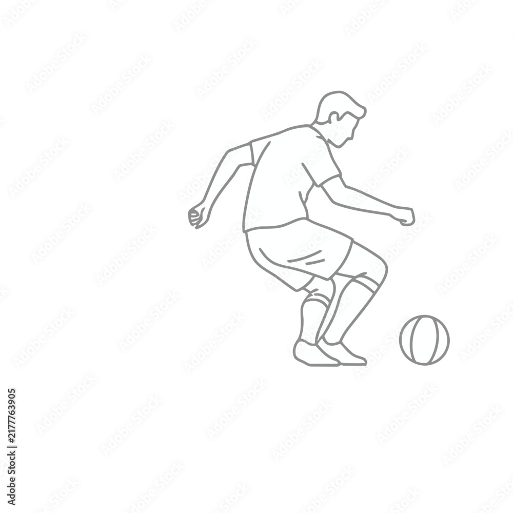 Fototapeta premium Soccer player kicking a ball