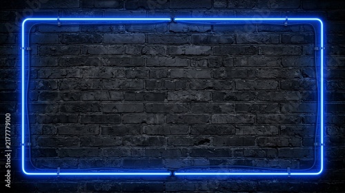A glowing blue neon rectangle frames an empty space against a dark textured brick wall, casting a cool ambient light that contrasts with the rough surface behind it