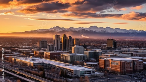 City Skyline at Sunset with Snowy Mountains