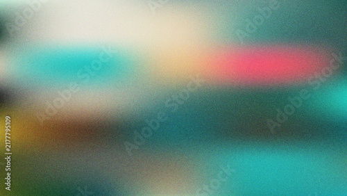 Abstract soft blurred teal and colorful gradient background with moody lighting and grain texture