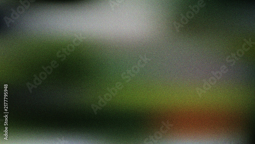 Abstract soft blurred dark and green gradient background with moody lighting and grain texture