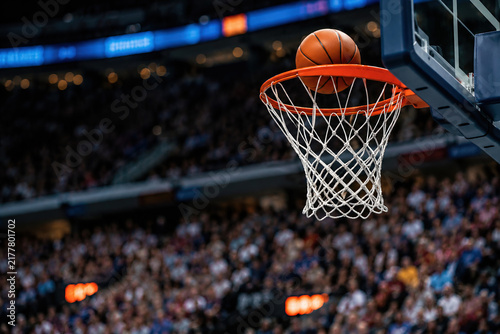 Basketball moving toward the hoop during a game