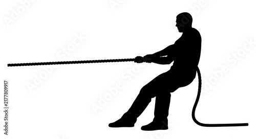 Man silhouette pulling a rope in a tug of war competition