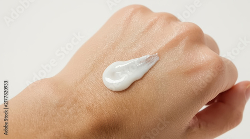 Plakat Hand with white moisturizing cream