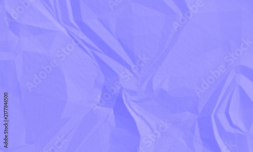 Abstract crumpled purple paper texture background with grainy noise effect for creative design projects