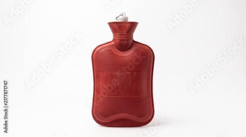 Red rubber hot water bottle for pain relief and warming
