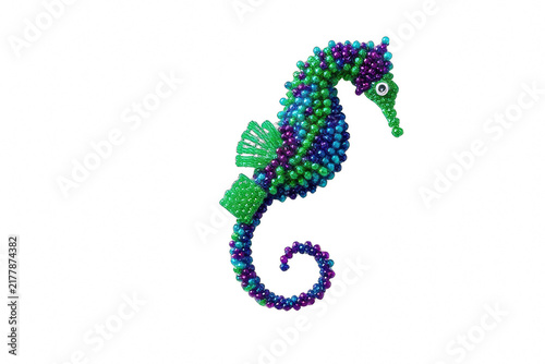 Decorative beaded seahorse isolated on black