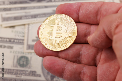 Canvastavla Close up of a hand showing shiny gold Bitcoin coins