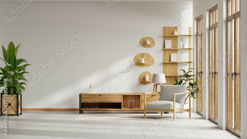 Modern minimalist living room interior with blank white wall mockup, wooden cabinet, armchair, and indoor plants- 3D rendering