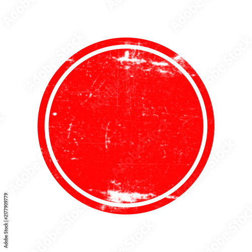A bright red circular stamp shape with a rough distressed texture for vintage design and label decoration
