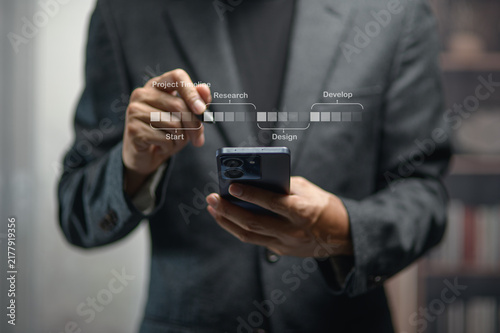 Business Professional Man Holding Smartphone with Project Timeline Chart