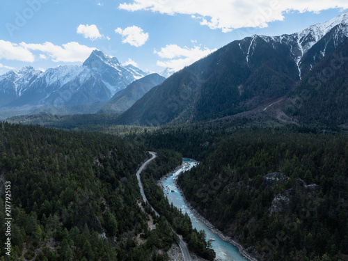 Canvas Print Aerial view of beautiful glacier in high altitude mountains landscape